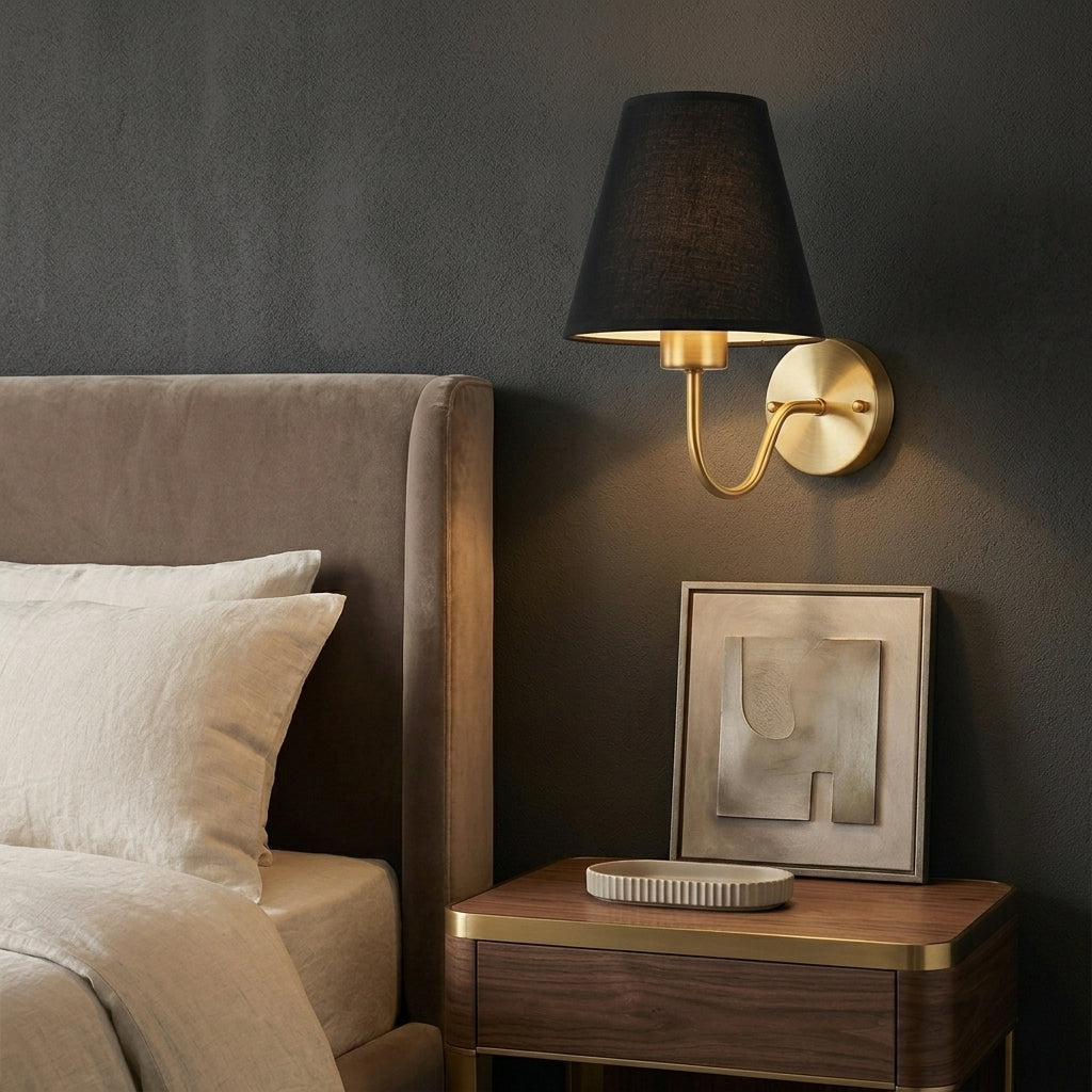 E27 wall lamp with black fabric shade in a dark bedroom