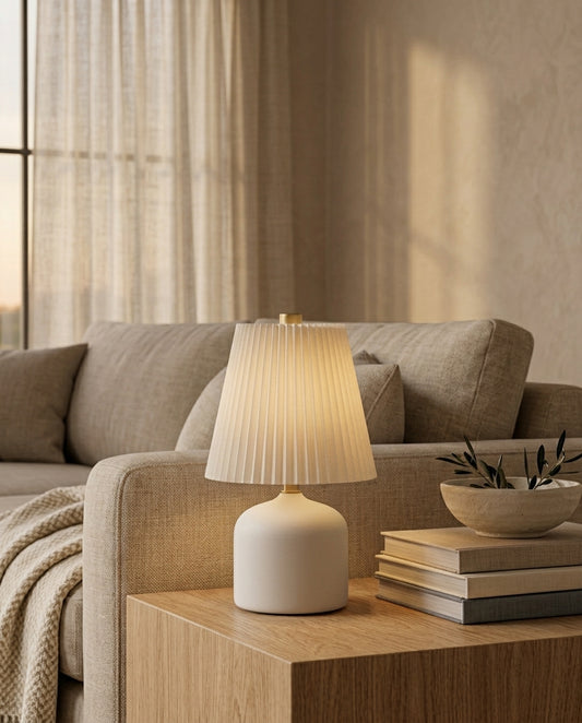 Touch table lamp styled on a wood side table beside a sofa in a living room