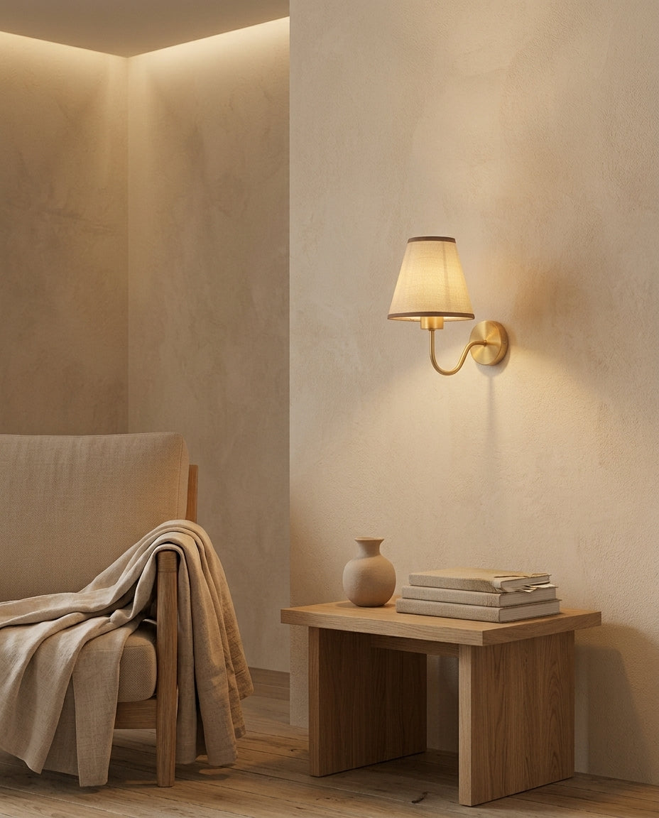 E27 wall lamp with tan fabric shade in a living room
