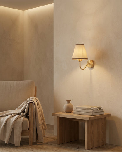 E27 wall lamp with tan fabric shade in a living room